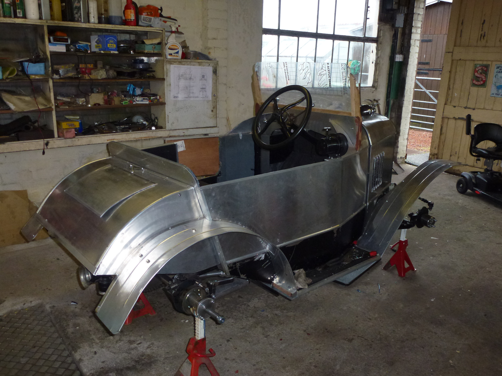 Having the car on axle stands gave easy access to refitting the overhauled engine and permitted coachwork detailing.