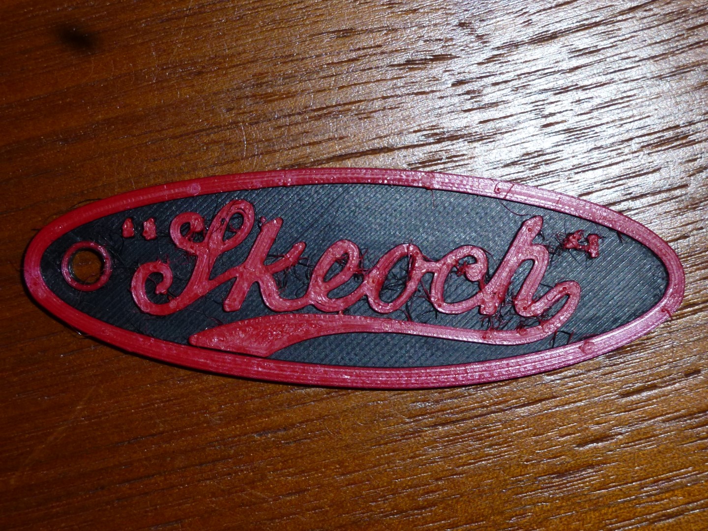 Our first 3D printed, red on black, Skeoch key fob