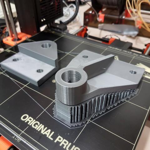 Our 3D printer printing a plastic bracket for our Skeoch cycle car project