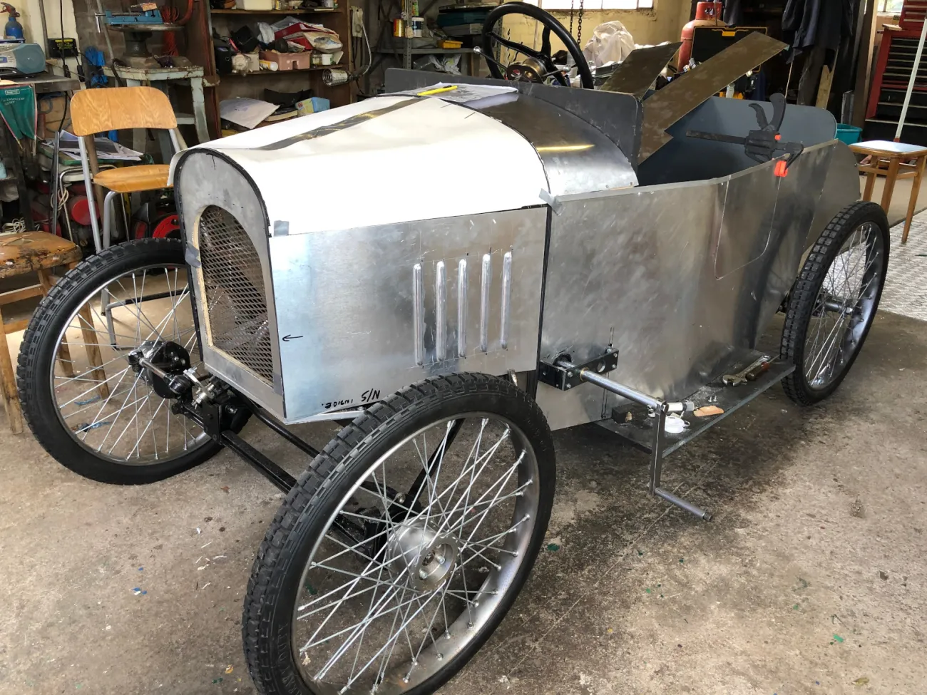 The starting mechanism which will allow a handle start via a chain driven sprocket on the engine flywheel