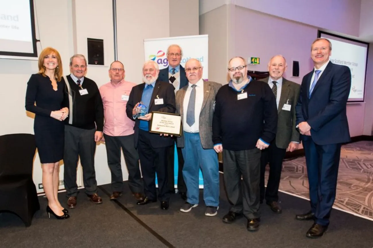 Members of The Shed receiving the award from Jackie Bird