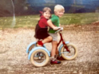 Jane and Simon playing with the trike in 1983